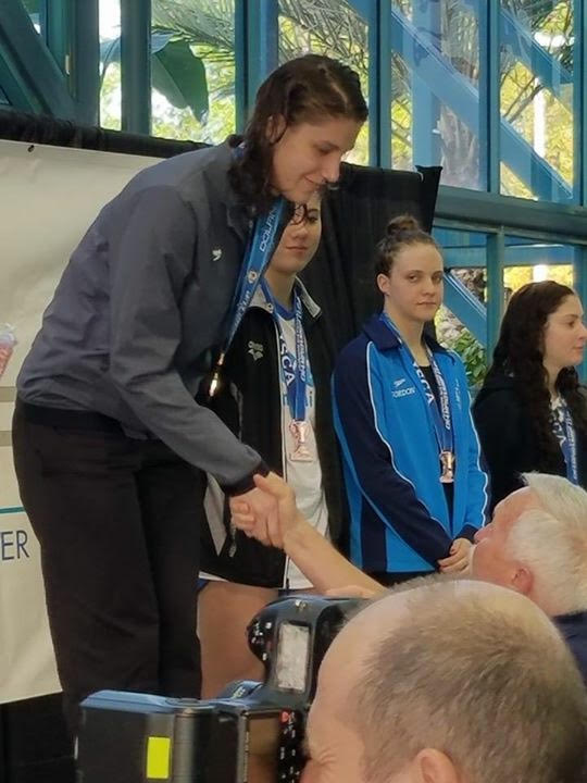 Holly Jansen atop the podium